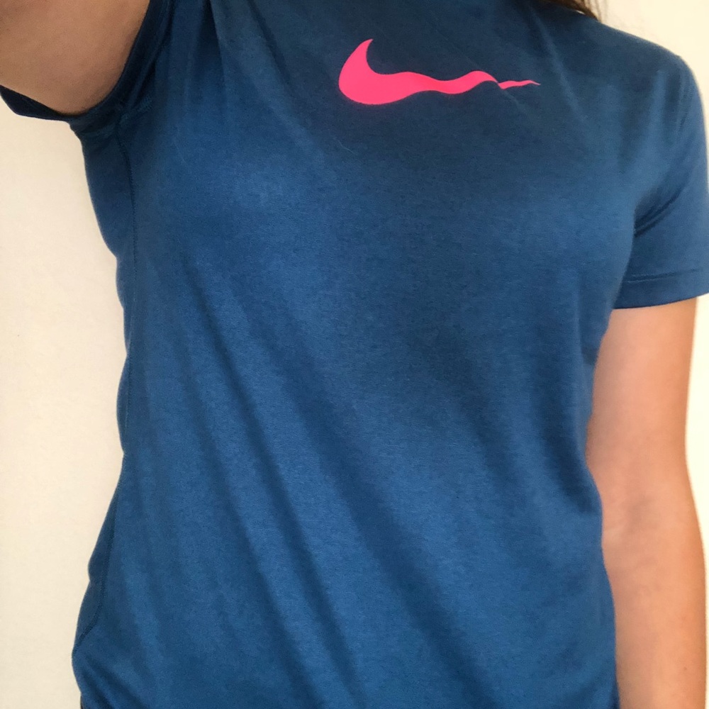 Blue athletic shirt with hot pink nike swoosh